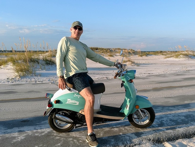 Chris Schroder on scooter, Gulf Islands National